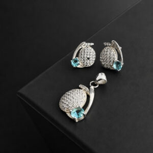 ARETE Y DIJE OVALO SATINADO CON ZIRCON PIEDRA CELESTE